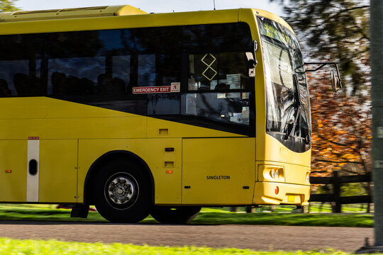 School bus traveling on pickup route in Singleton suburb