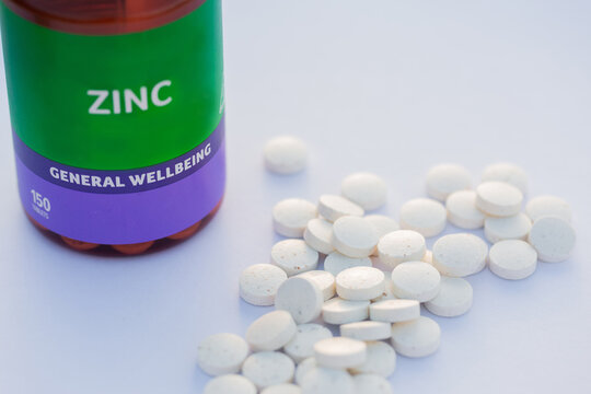 Zinc supplements in tablet form for general wellbeing on white table
