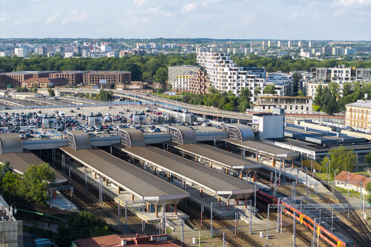 Krakow, Poland - 20 July 2026: Aerial view of Krakow Glowny train station with its modern platforms, adjacent parking area, and surrounding urban architecture in the city center.