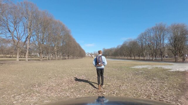 Solo traveler exploring the famous Norwegian park changing his direction