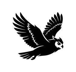 Fototapeta premium Silhouette of an owl in flight with wings spread wide.