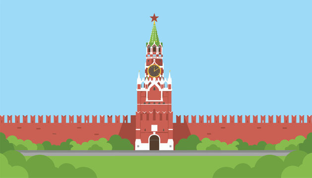 Spasskaya Tower of the Moscow Kremlin with its famous clock and red brick wall over a green park and blue sky.