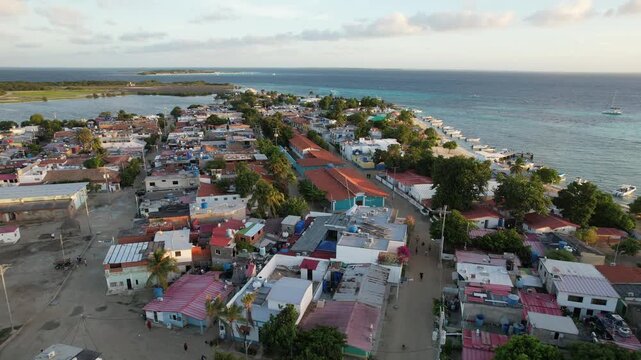 Los Roques, Los Roques, Venezuela - 01 January 2025: Aerial view of the Los Roques archipelago featuring colorful houses, sandy streets, and turquoise Caribbean waters.