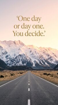 Inspirational Quote About New Beginnings Featuring a Scenic Road Leading Toward Majestic Snow Capped Mountains at Sunset