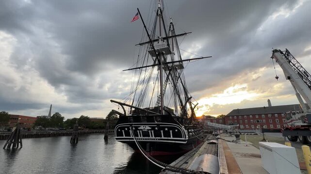 USS Constitution, historic tall ship "Old Ironsides," docked at Charlestown Navy Yard, Boston, at sunset.
