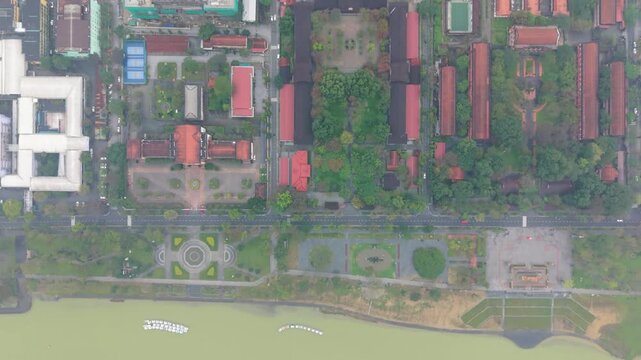 Aerial View Hue Citadel Red Roofs, Symmetrical Courtyard And Treelined Pathways, Historic Palace Blocks Surrounded By Urban Grid And Moat, Overcast Light Highlighting Heritage Textures