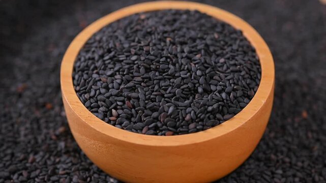 Black Sesame Seeds in Wooden bowl