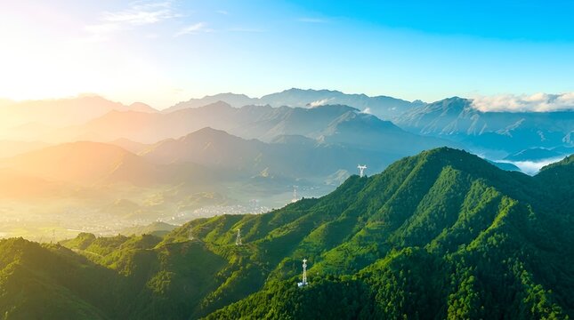 Aerial view of rolling green mountain ridges during a bright sunny morning sunrise with soft haze and clear blue sky mountains landscape sunlight environment panoramic wilderness