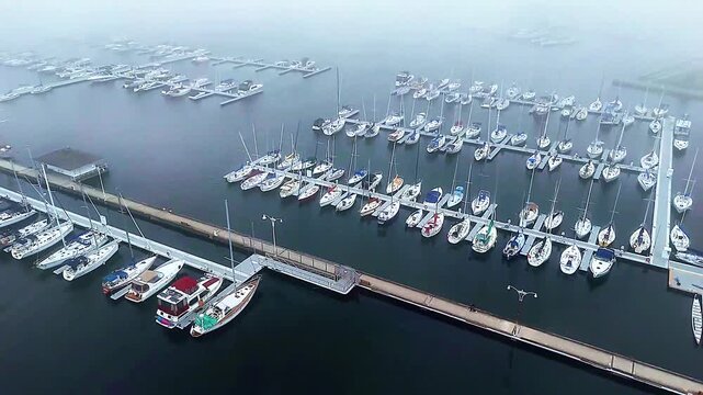 Aerial view of boats docked in a marina harbor