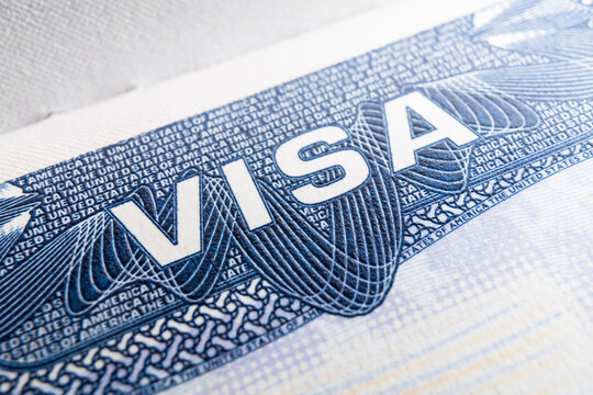 Macro close-up of a United States of America US visa stamp sticker in passport with copy space. US visa the USA visa news, America closed borders, nationality. High quality photo