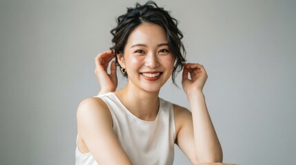 Fototapeta premium Portrait of a smiling young asian woman with natural makeup