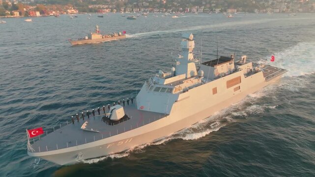 Istanbul, Turkey - 30 June 2026: Aerial view of Turkish naval ships sailing on the Bosphorus at sunset.
