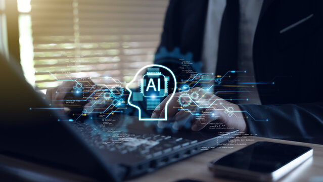 A programmer uses a laptop equipped with an AI coding assistant for software development.