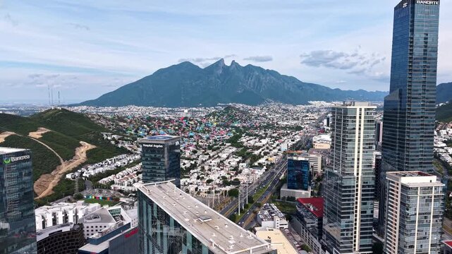 San Pedro Garza Garcia, Mexico - 13 June 2026: Aerial view of the modern skyline and Cerro de la Silla mountain under a clear sky in San Pedro Garza Garcia, Nuevo Leon, Mexico.