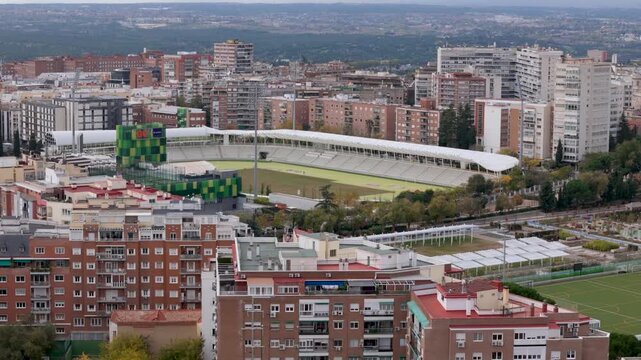 Madrid, Spain - 12 June 2026: Aerial view of an urban stadium surrounded by dense residential apartment buildings and city streets in Madrid, Community of Madrid, Spain.