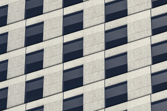 Abstract geometric office building facade with repeating windows