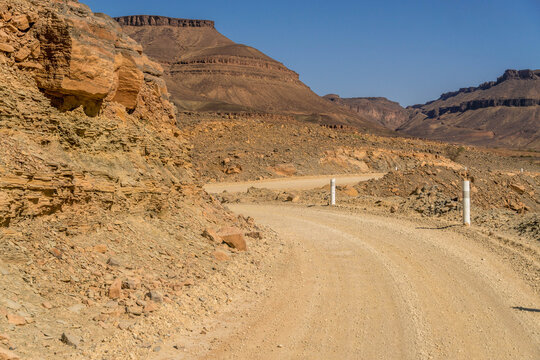 Rocky road through Adrar Plateau and Amojjar Pass at Western Sahara landscape of Sahel and Sahara desert, Mauritania.
