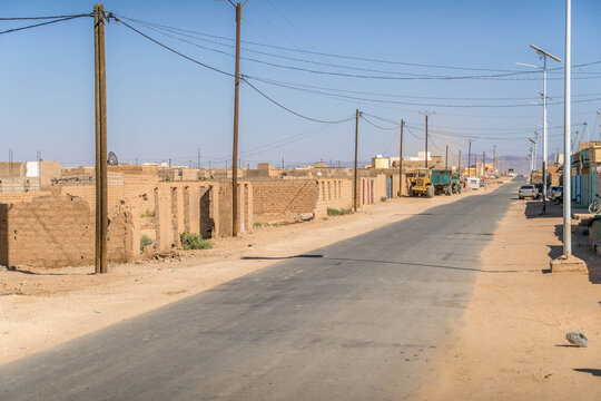 Atar city street in Mauritania, a small town in West Africa Sahel region, with dusty road during the hot summer day.

