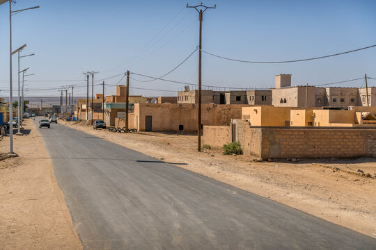 Atar city street in Mauritania, a small town in West Africa Sahel region, with dusty road during the hot summer day.
