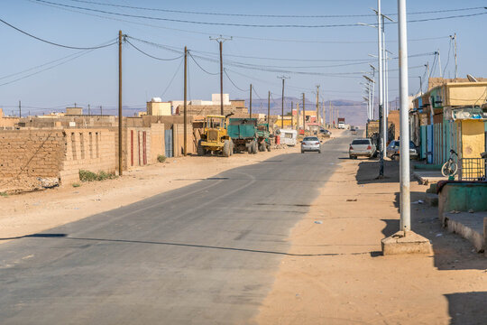 Atar city street in Mauritania, a small town in West Africa Sahel region, with dusty road during the hot summer day.
