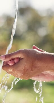 Water, hygiene and person washing hands outdoor for wellness, health or self care in countryside. Sustainability, organic and liquid for cleaning skin for dirt, germs or bacteria removal on farm.