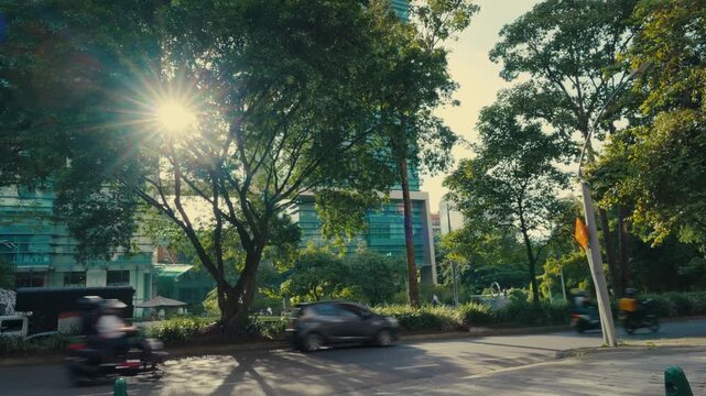 Medellin, Colombia - Sunlit Park and Street Scene with Modern Glass Building