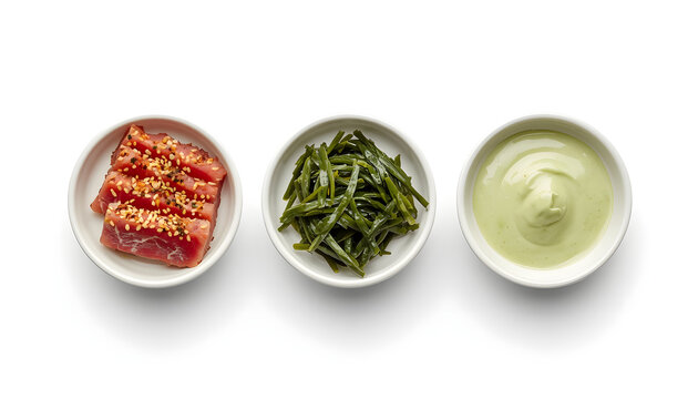 Three bowls of Japanese side dishes. Tuna sashimi, seaweed salad and wasabi sauce.