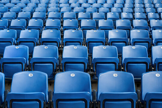 Empty Rows of Blue Stadium Seats Ready for Event