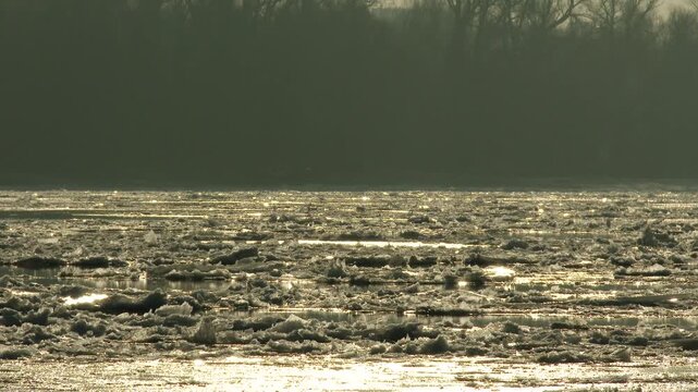 4K Freezeup and Frazil Ice Floating on River on a Freezing Winter Day