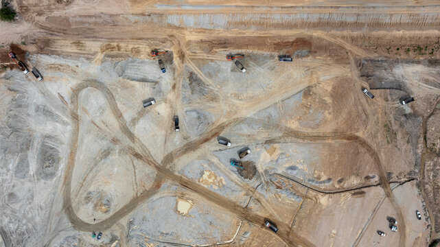 Aerial view motor grader civil at construction site, Motor grader work on construction site, Road grader on road construction site machine work on the construction of new road.