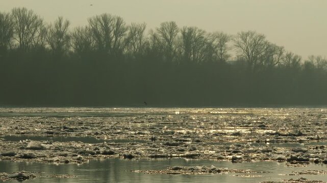 4K Freezeup and Frazil Ice Floating on River on a Freezing Winter Day