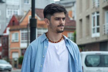 Fototapeta premium Young man smiling confident walking at street