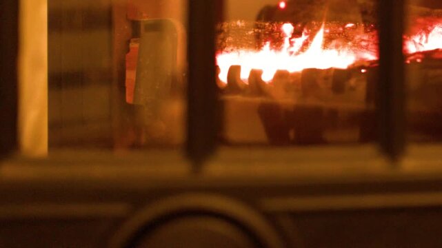 Burning Logs in a Cast Iron Wood Stove Fireplace