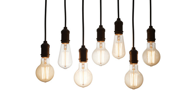 Collection of vintage retro hanging light bulbs glowing brightly on white background with copy space