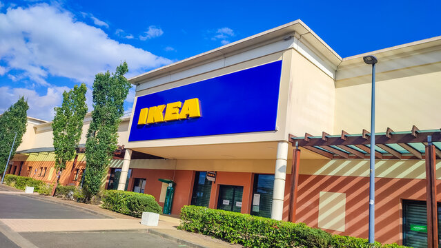 Le Mans, France - July 26, 2026: IKEA Compact store exterior with blue signage and modern architecture, surrounded by green landscaping and clear blue sky