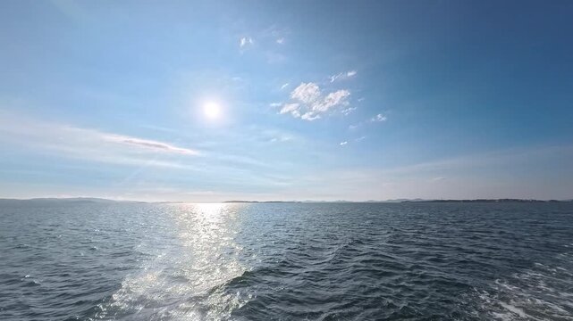 Coastal seascape with glowing sun path for departure, navigation, and corporate progress project