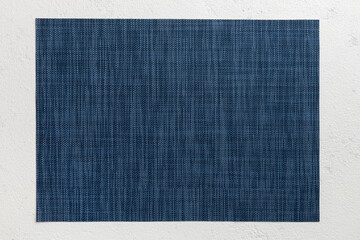 Naklejka premium Top view of grey tablecloth for food on cement background. Empty space for your design