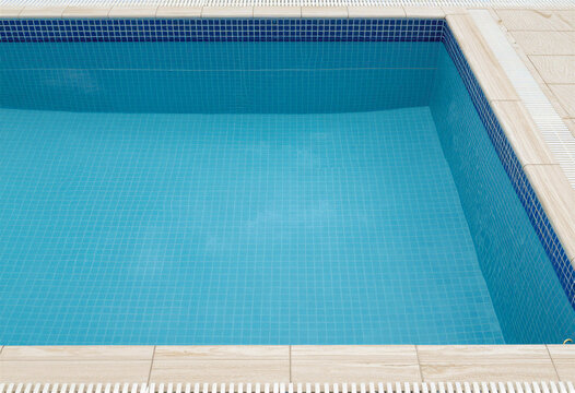 Empty swimming pool, tiled floor