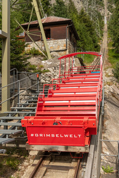 07 July 2026, Guttannen, Switzerland. Gelmerbahn funicular carriage at the lower station with steep railway and Grimselwelt branding in the Swiss Alps