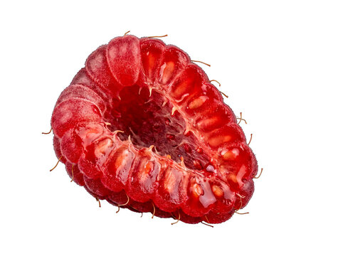 Vibrant red raspberry half, showcasing intricate texture and juicy drupelets.