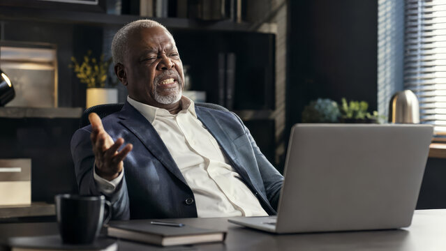 Frustrated Senior Black Businessman Gesturing at Laptop in Office