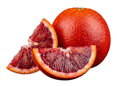 Delicious whole blood orange and two vibrant ruby red slices, juicy and ripe, a symbol of fresh healthy eating today.