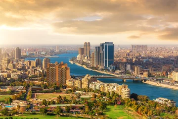 Panoramic aerial top view of Cairo cityscape along the Nile River at sunset, Egypt © AlexAnton