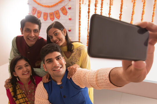Colleagues clicking a selfie in office on the occasion of Diwali celebration 