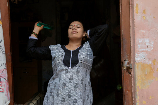 woman combing her hair