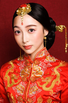 Asian women in ancient costumes dressed in red