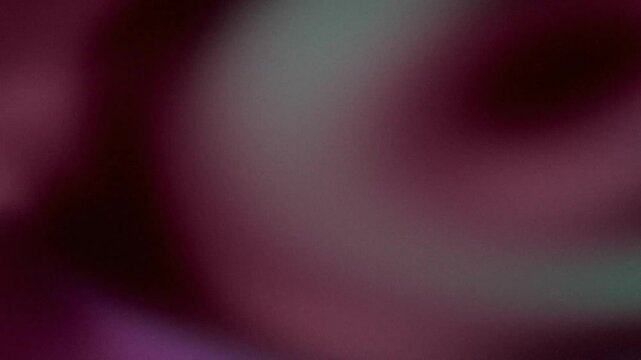 Teal and maroon abstract light leaks shifting on dark textured backdrop cinematic moody retro film grain aesthetic