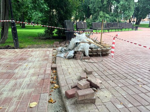work on laying new tiles in a public park