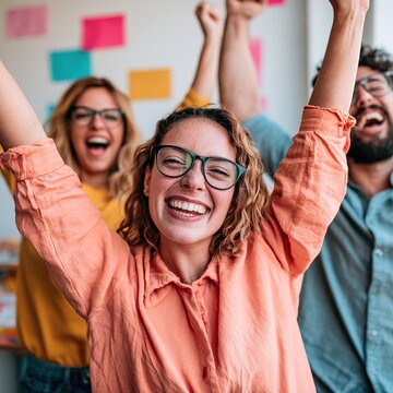 Diverse business team celebrating success winning together