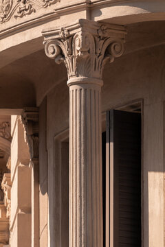 Elements of architectural decorations of buildings, columns and tops, gypsum molding, wall texture and stucco patterns. On the streets in Barcelona, public places.